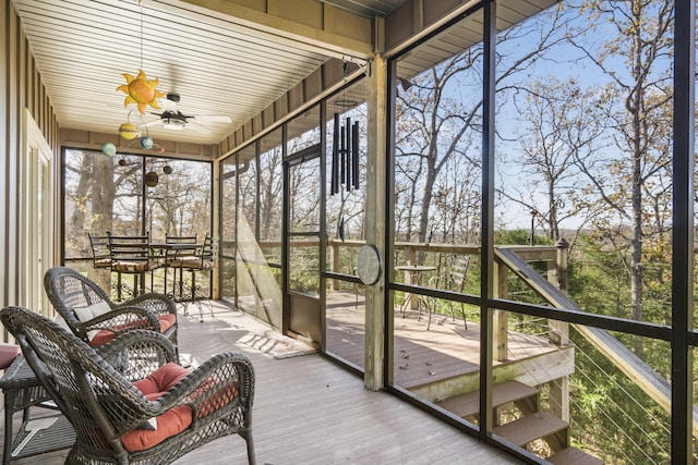 sunroom / solarium with ceiling fan