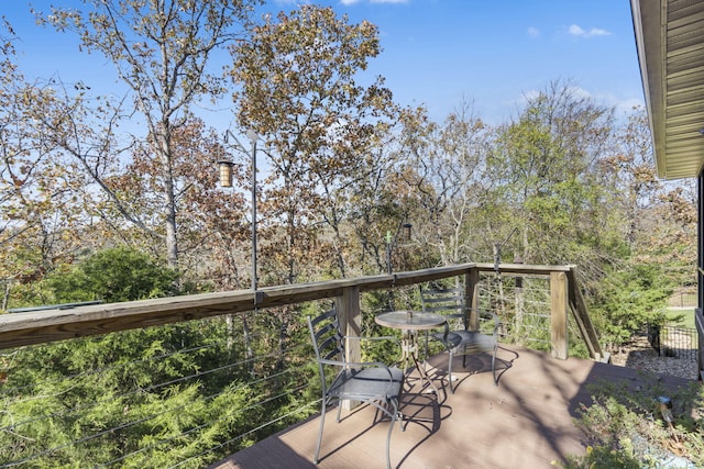 wooden balcony featuring a deck