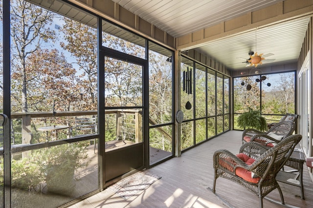 unfurnished sunroom with ceiling fan and a healthy amount of sunlight