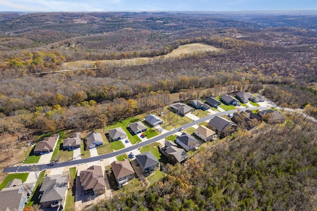 311 Cedar Glade Dr, Branson West, MO 65737 - aerial view of property and surrounding area featuring a heavily wooded area and nearby suburban area