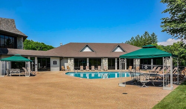 view of pool featuring a patio