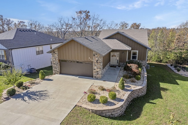 311 Cedar Glade Dr, Branson West, MO 65737 - view of front of house with board and batten siding, an attached garage, a front lawn, concrete driveway, and stone siding