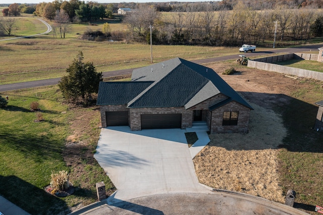 birds eye view of property with a rural view