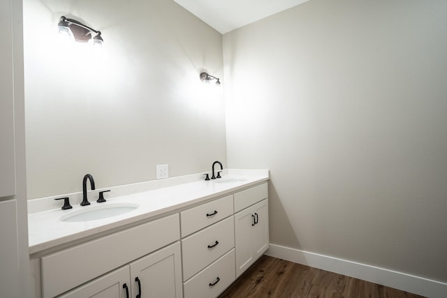 bathroom featuring wood-type flooring and vanity