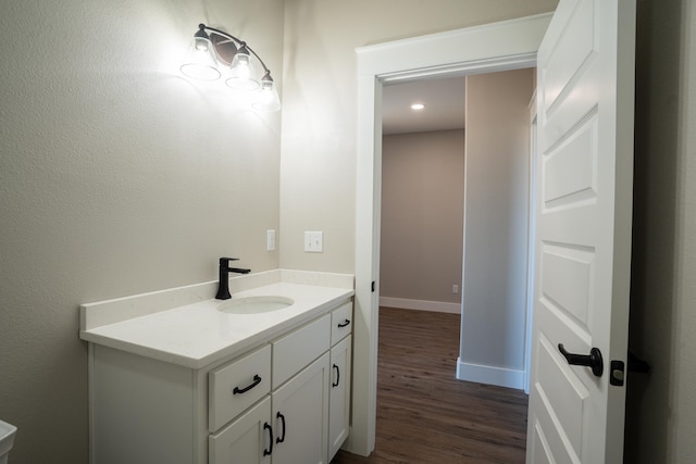 bathroom featuring wood-type flooring and vanity