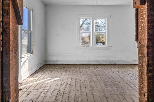 spare room featuring light wood-type flooring