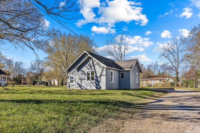 view of home's exterior with a yard