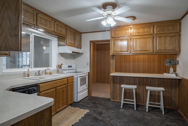 kitchen featuring dishwasher, sink, white electric range oven, and wooden walls