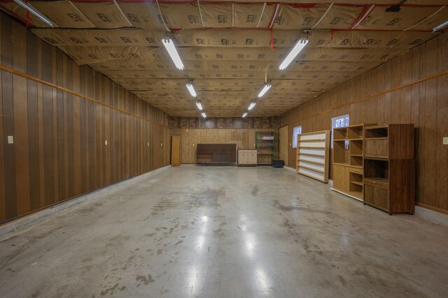 garage featuring wooden walls