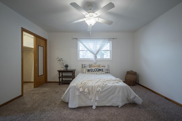 bedroom featuring carpet flooring, ceiling fan, and a closet