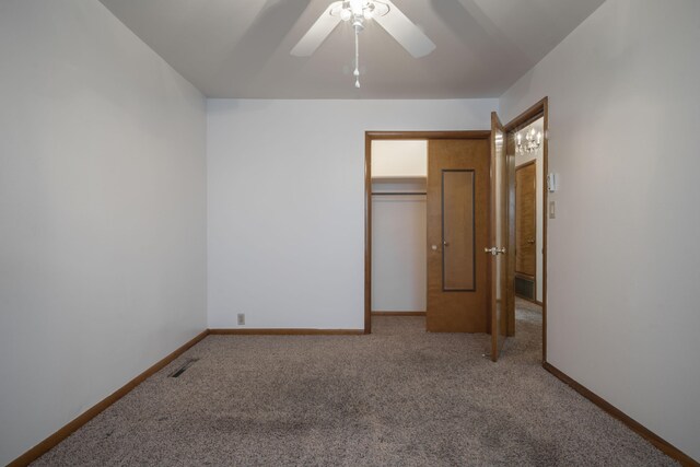 unfurnished bedroom with carpet, a closet, and ceiling fan