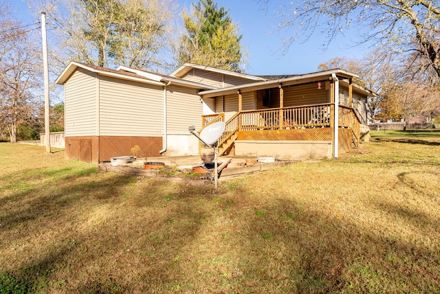 back of property featuring a lawn