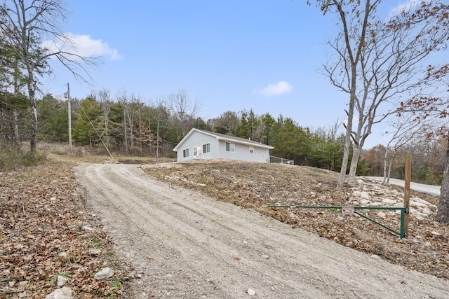 1259 Meadowview Rd, Galena, MO 65656 - view of front of house with dirt driveway and a view of trees
