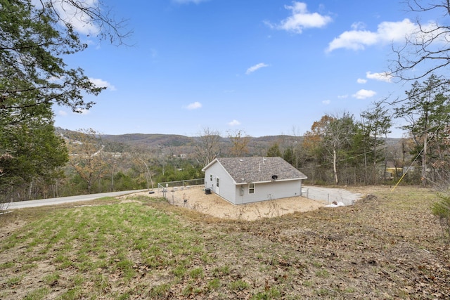 view of home's exterior with a mountain view