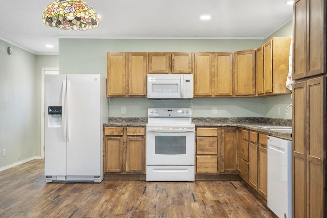 kitchen with dark hardwood / wood-style flooring, white appliances, and crown molding