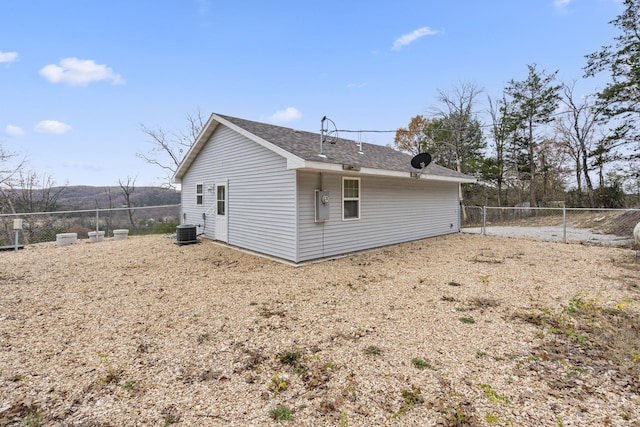 back of property featuring central AC unit