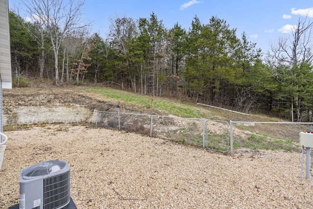 view of yard featuring central air condition unit