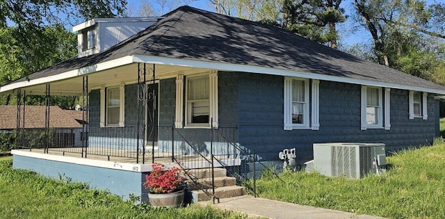 exterior space with cooling unit and covered porch