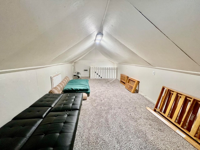 bonus room with carpet flooring and lofted ceiling