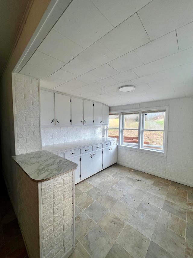 interior space featuring stone tile floors