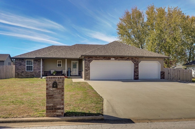 ranch-style home featuring a front yard and a garage