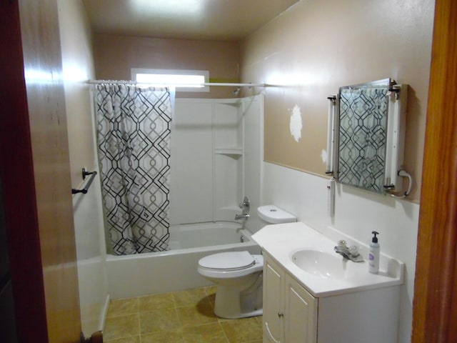 full bathroom featuring tile patterned flooring, shower / bath combo with shower curtain, vanity, and toilet