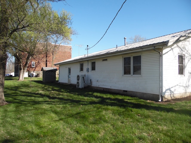 back of house with a yard