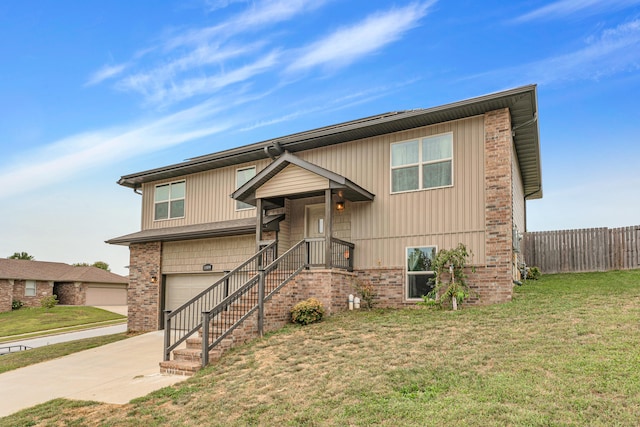 split foyer home featuring a front yard and a garage