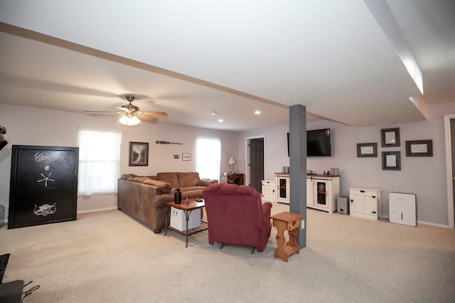 living room featuring light carpet and ceiling fan