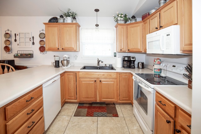 kitchen featuring sink, light tile patterned floors, decorative light fixtures, and white appliances