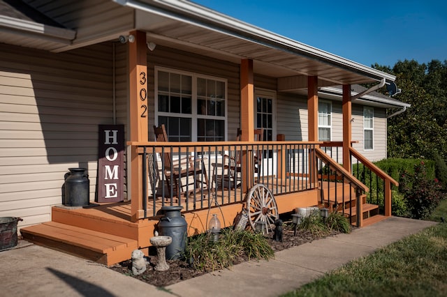 view of exterior entry featuring a porch