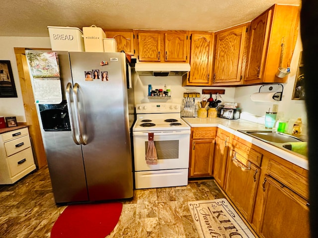 kitchen with stainless steel fridge, a textured ceiling, white electric stove, and sink