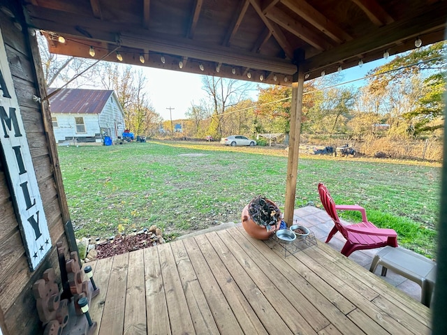 wooden deck with a lawn