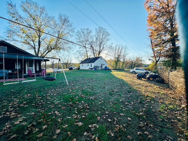 view of yard with covered porch