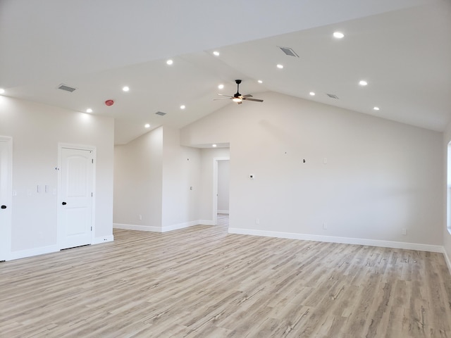 empty room featuring ceiling fan, high vaulted ceiling, and light hardwood / wood-style flooring