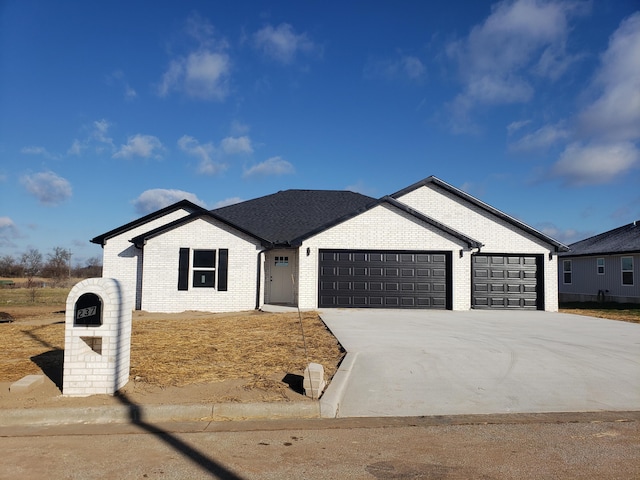 view of front of property with a garage