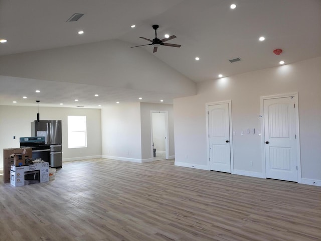 living room with light wood-type flooring, high vaulted ceiling, and ceiling fan