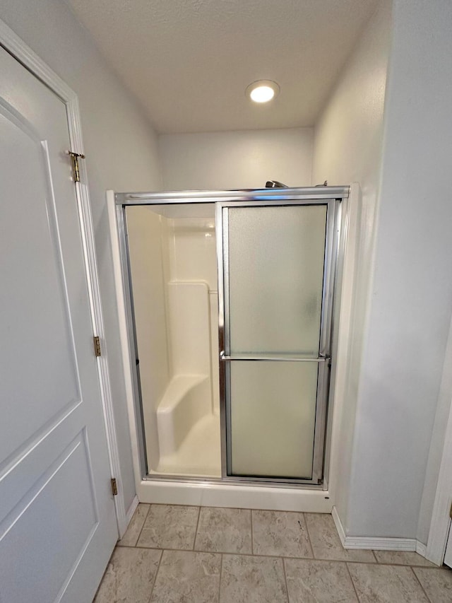 bathroom with an enclosed shower