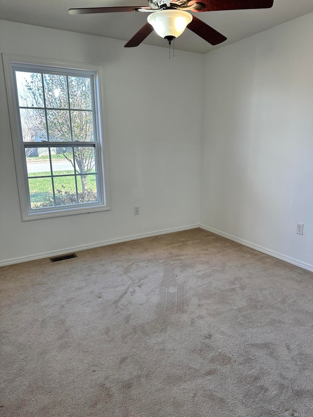 unfurnished room with light carpet