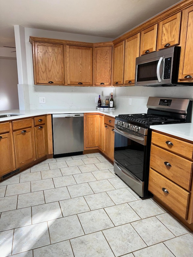 kitchen with sink and appliances with stainless steel finishes