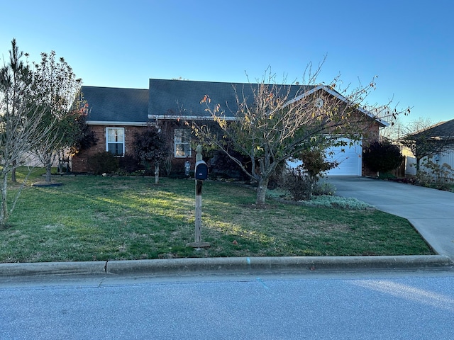 ranch-style home with a front yard and a garage