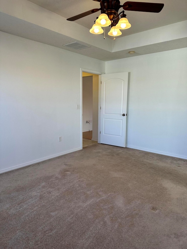 empty room with carpet and ceiling fan