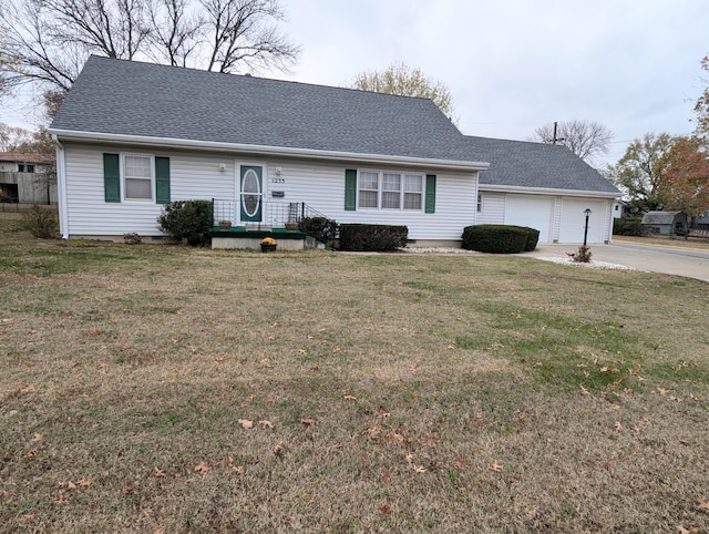 single story home with a garage and a front yard