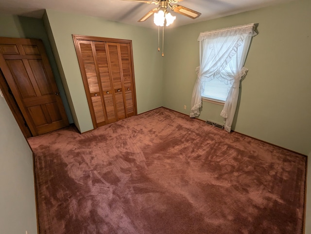 bedroom with carpet flooring, ceiling fan, and a closet