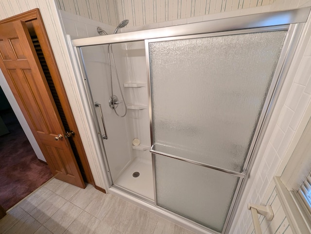 bathroom with a shower with shower door