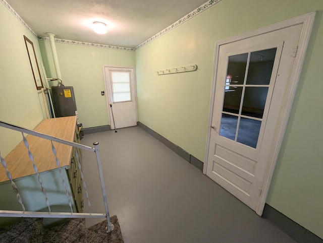 doorway to outside featuring concrete flooring