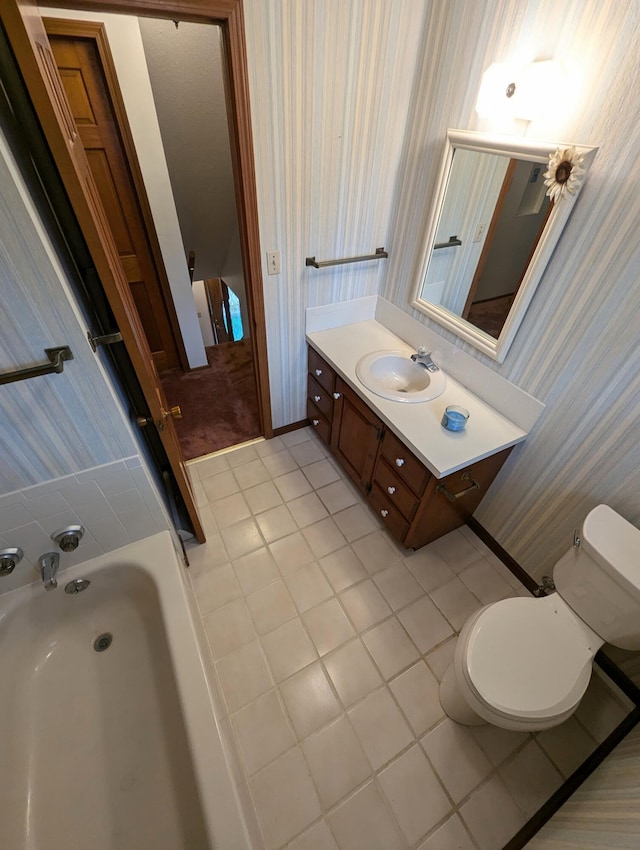 bathroom featuring tile patterned flooring, vanity, and toilet