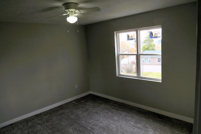 unfurnished room featuring ceiling fan and carpet floors