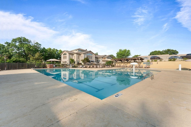 view of swimming pool featuring a patio