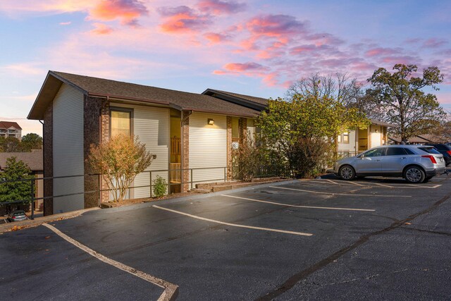 257 Clubhouse Dr Unit 14, Branson, MO 65616 - view of parking at dusk